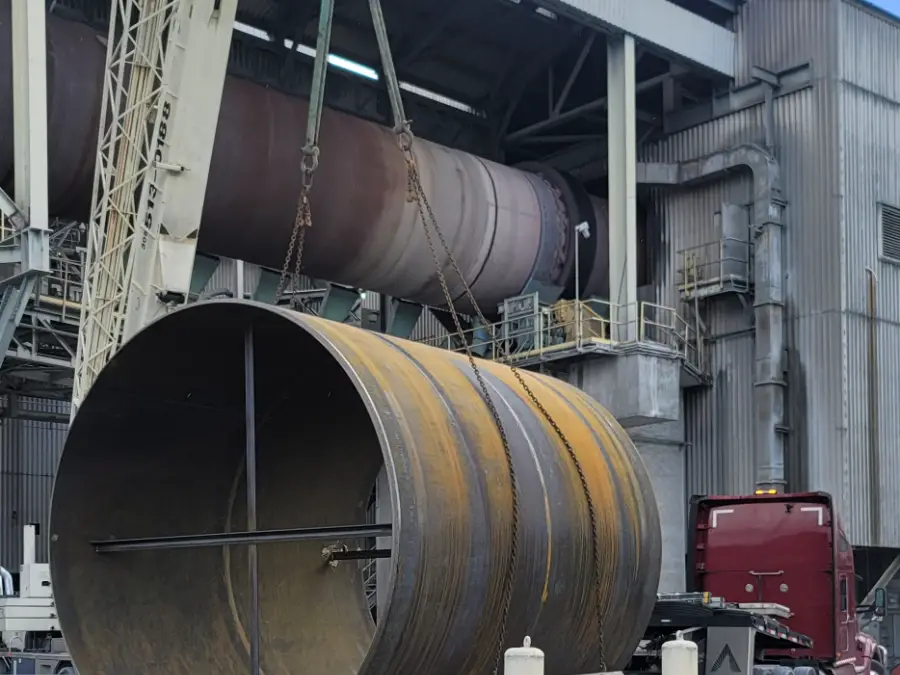 Crane lifting a heavy plate steel cylinder fabricated by TL Welding at a South Florida industrial plant